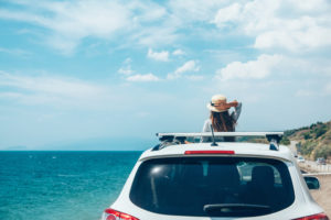 girl in car near beach