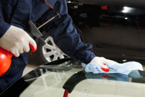 man fixing car