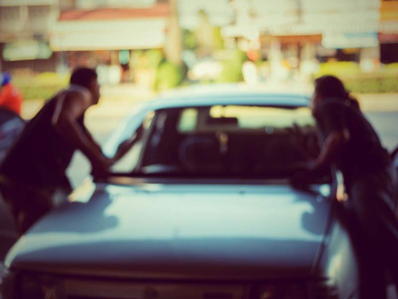 Two person checking the car in auto glass express at Las Vegas, NV