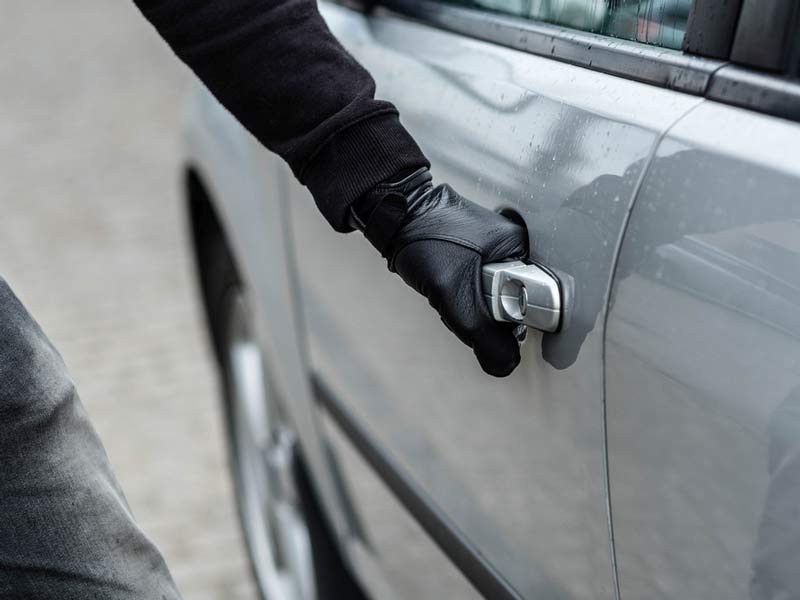 The person trying to open the car door at Las Vegas, NV How Common Are Car Break-Ins in Arizona?