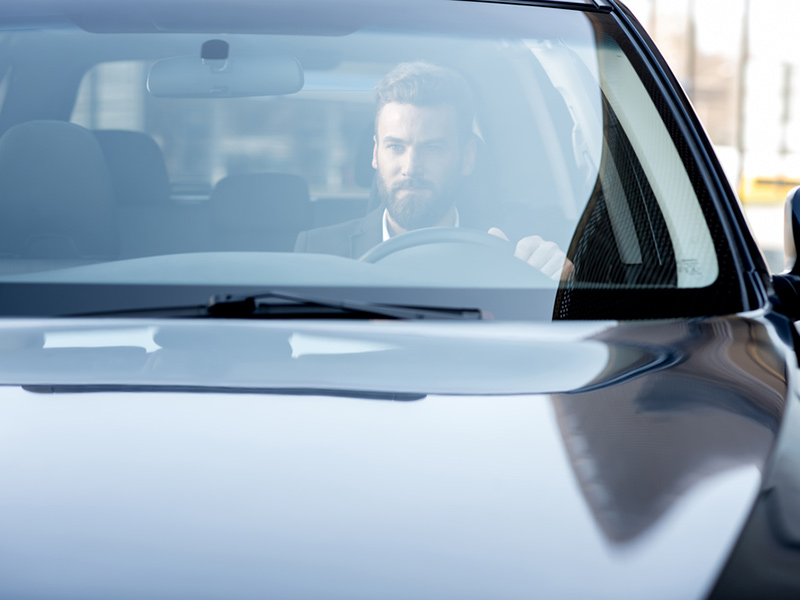 Man driving the car with new windshield glass at Las Vegas, NV