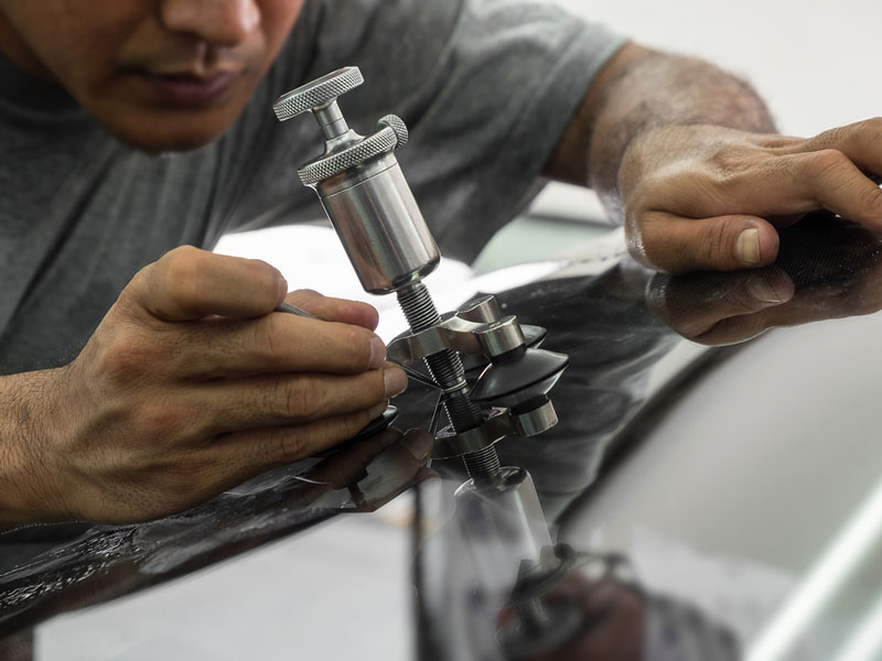man fixing tool on surface