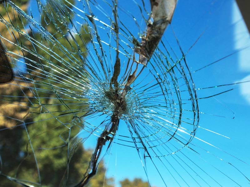 A broken windshield glass
