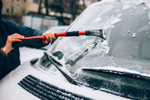 car front glass being rubbed with tool