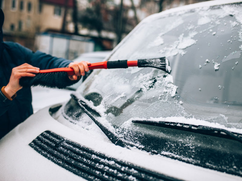 car front glass being rubbed with tool