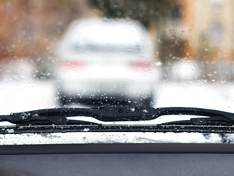 The blurred car windshield while driving 